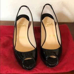 Christian Louboutin peep toe sling back pumps.